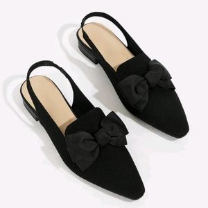 Black flats with bow